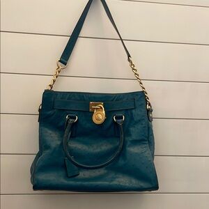 Elegant Blue Handbag with Gold Accents